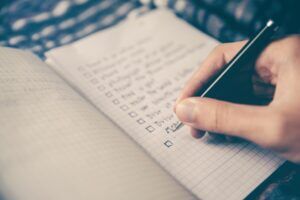 handwritten checklist in a journal